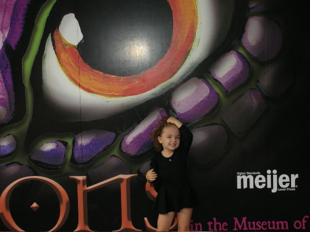 Posing in front of the dragon sign.