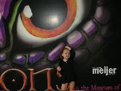 Posing in front of the dragon sign.