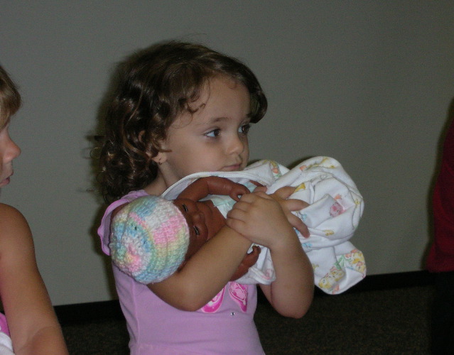 sibling class - holding doll