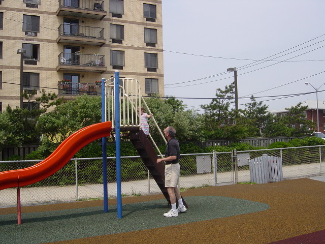 Climbing the slide at the boardwalk.