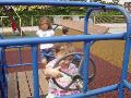 Driving the car at the playground.