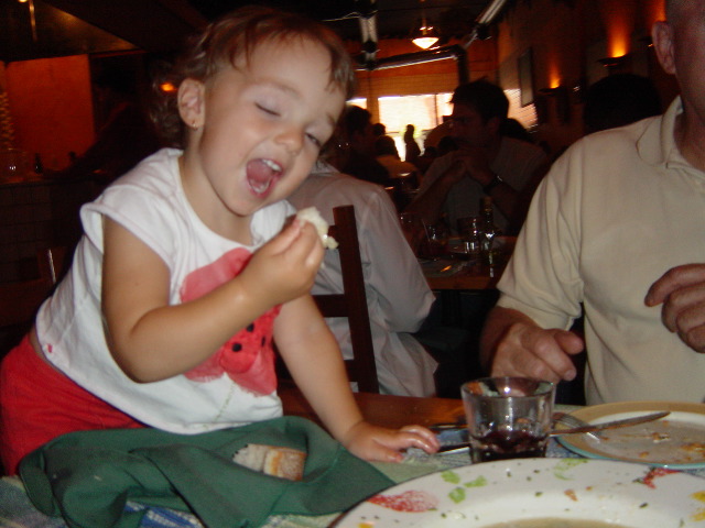 Dipping the bread in the mussel sauce