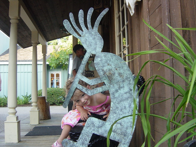 Posing with the giant kokopelli